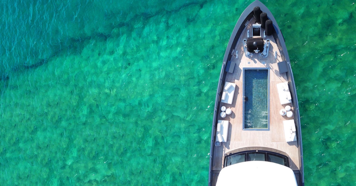 Aerial view of a luxury motor yacht at anchor